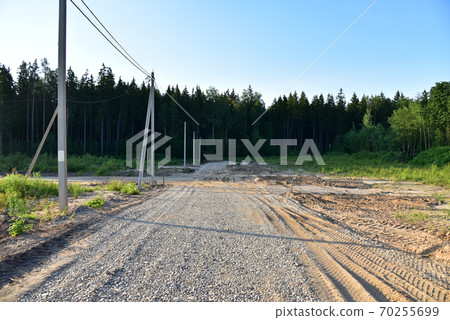 Road construction in the countryside. Gravel for road work at construction site Road construction in the countryside. Gravel for road work at construction site 70255699