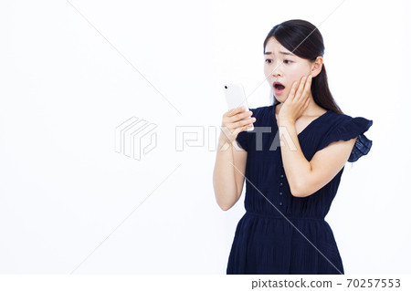 Women in their 30s Smartphone White background Women in their 30s Smartphone White background 70257553