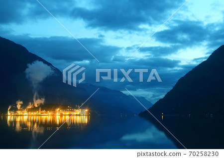 Night city Odda in the reflection of water. Norway Night city Odda in the reflection of water. Norway 70258230