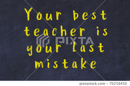 Black chalkboard with wise inscription on it Black chalkboard with wise inscription on it 70258450