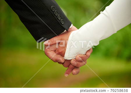 wedding couple hand in hand wedding couple hand in hand 70258638
