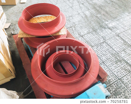 Red Stuffing Boxes on concrete floor 70258781