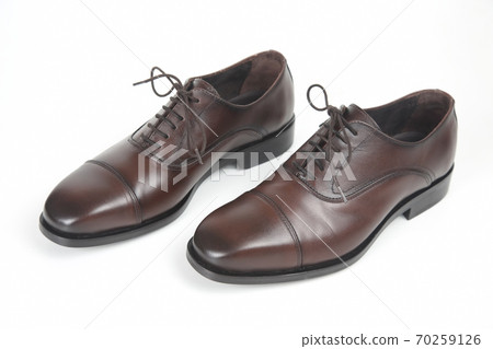 Classic men's brown Oxford shoes on white background. Leather shoes Classic men's brown Oxford shoes on white background. Leather shoes 70259126