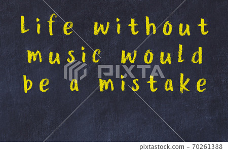 Chalk wise inscription on black chalkboard Chalk wise inscription on black chalkboard 70261388