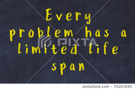 Chalk inscription of smart quote on black desk 70261689