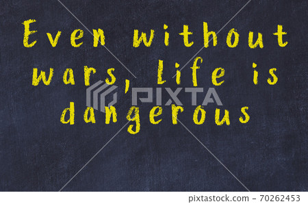Chalk inscription of smart quote on black desk Chalk inscription of smart quote on black desk 70262453