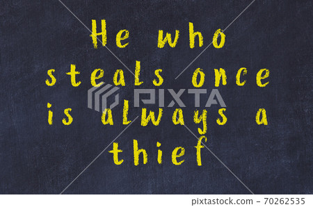 Chalk inscription of smart quote on black desk Chalk inscription of smart quote on black desk 70262535
