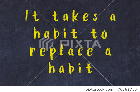 Chalk inscription of smart quote on black desk Chalk inscription of smart quote on black desk 70262719