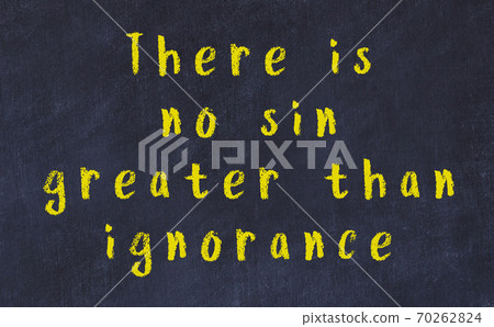 Chalk inscription of smart quote on black desk 70262824