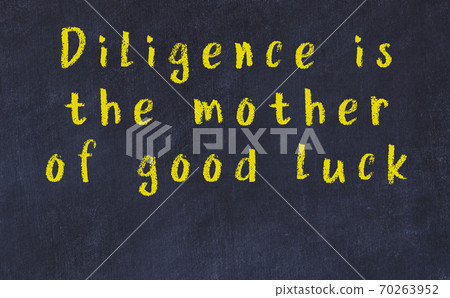 Chalk inscription of smart quote on black desk Chalk inscription of smart quote on black desk 70263952