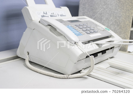 The fax machine use for Sending documents in the office, concept equipment needed in office 70264320