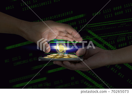Human hand holding mobile smart phone with piles of golden coins and bitcoin symbol on binary background 70265073