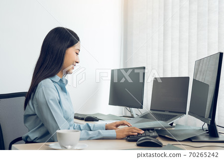 Asian young female programmer working developer programing on a computer code at office. Asian young female programmer working developer programing on a computer code at office. 70265242
