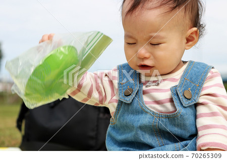 1 year old with a moody face 70265309