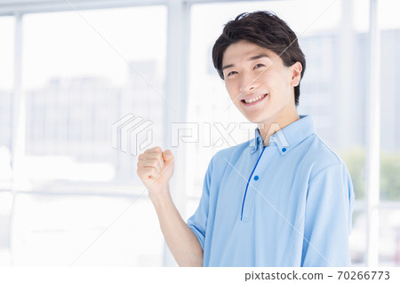 Portrait of a male caregiver 70266773