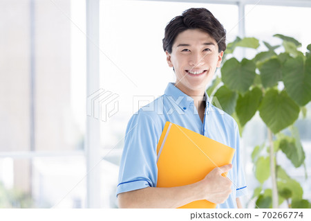 Portrait of a male caregiver 70266774