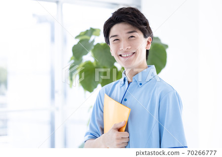 Portrait of a male caregiver 70266777