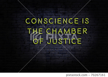 Wise quote. Neon inscription against brick wall 70267161