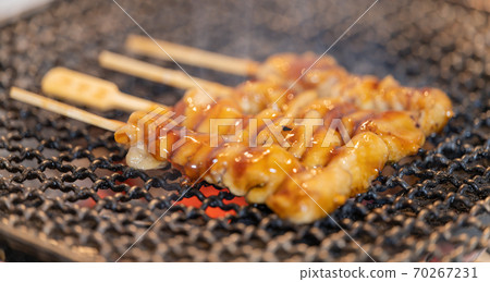 Yakitori (chicken kawa) grilled over charcoal Yakitori (chicken kawa) grilled over charcoal 70267231