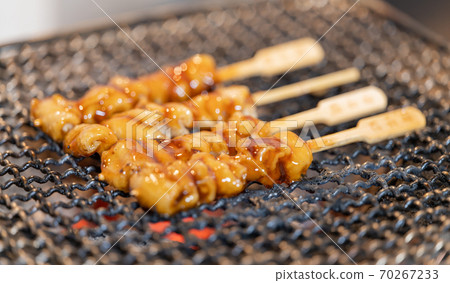 Yakitori (chicken kawa) grilled over charcoal Yakitori (chicken kawa) grilled over charcoal 70267233
