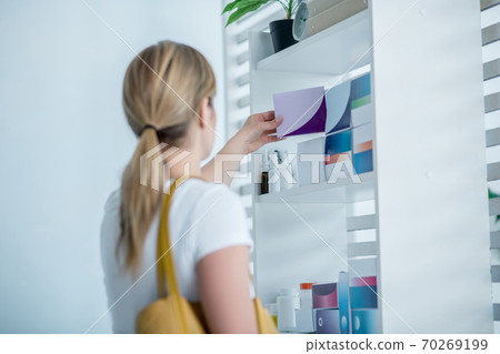 Woman choosing medicines in the drug store Woman choosing medicines in the drug store 70269199