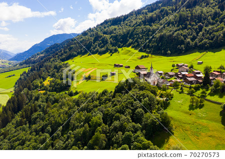 Mountain landscape with alpine village of Cavardiras, Switzerland Mountain landscape with alpine village of Cavardiras, Switzerland 70270573