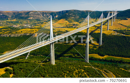 Cable-stayed Millau Viaduct spanning Tarn River valley, France 70270691