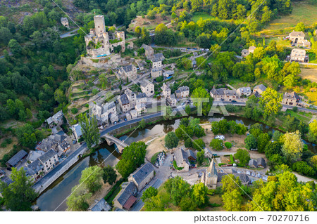 Drone view of Belcastel village overlooking fortified castle, France 70270716