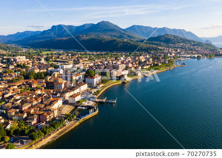 Aerial view of Luino, is small town on the shore of Lake Maggiore in province of Varese Aerial view of Luino, is small town on the shore of Lake Maggiore in province of Varese 70270735
