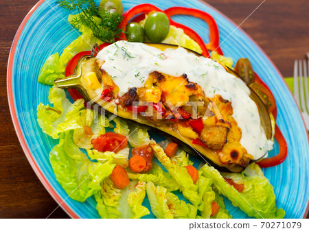 Stuffed eggplant with vegetables and cheese 70271079