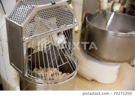Making bread dough in kneading machine Making bread dough in kneading machine 70271209