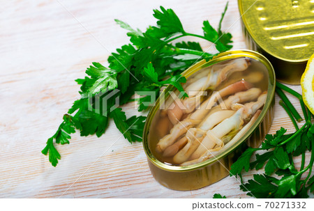 Canned natural mollusks Solen with parsley and lemon Canned natural mollusks Solen with parsley and lemon 70271332