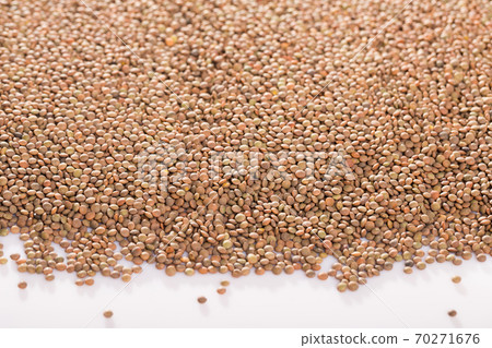 Raw lentils on white background Raw lentils on white background 70271676