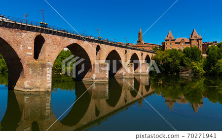 Montauban city on sunny day. Medieval bridge over the Tarn river Montauban city on sunny day. Medieval bridge over the Tarn river 70271941