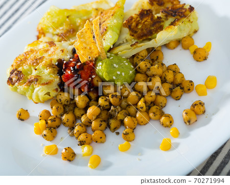 Cabbage in batter with chickpeas and sauces Cabbage in batter with chickpeas and sauces 70271994