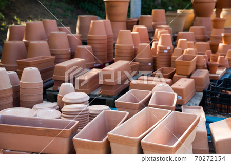 Clay pots for garden plants in store Clay pots for garden plants in store 70272154