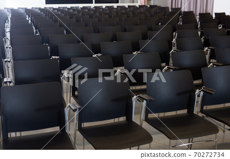 Plastic chairs in conference room 70272734