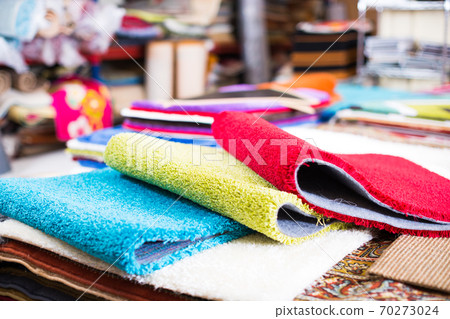 Assortment of colour carpets in the store Assortment of colour carpets in the store 70273024