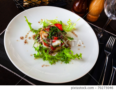 Cod timbale with roasted red peppers, arugula and olives Cod timbale with roasted red peppers, arugula and olives 70273046