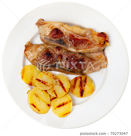 Appetizing fried pork with potatoes and herbs Appetizing fried pork with potatoes and herbs 70273047