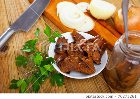 Salad of pickled red pine mushrooms, onion and greens Salad of pickled red pine mushrooms, onion and greens 70273261