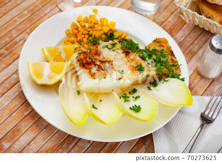 Pink cusk-eel fillet with endive, pickled corn, lemon and greens 70273625