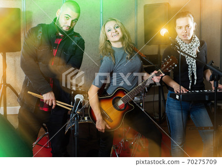 Joyful guitarist, drummer and keyboardist Joyful guitarist, drummer and keyboardist 70275709