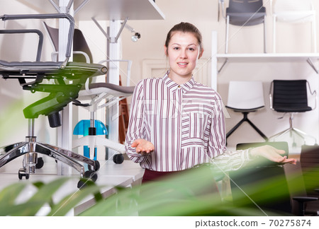 Woman seller inviting to chair chop 70275874