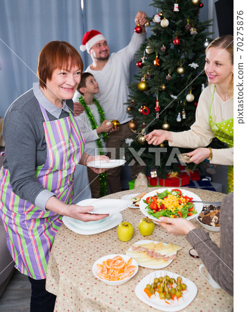 Family serving table for Christmas dinner Family serving table for Christmas dinner 70275876