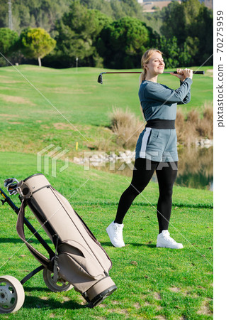 Woman 25-29 years old is succeeded in ball hitting Woman 25-29 years old is succeeded in ball hitting 70275959