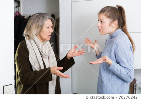 Women having emotional conversation 70276242