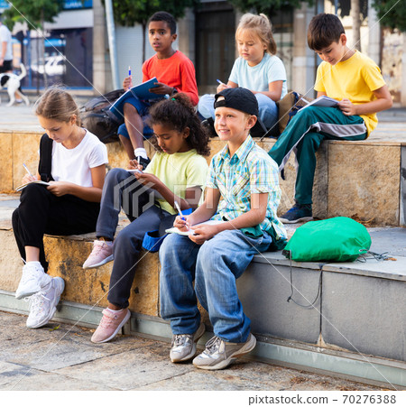 Group of kids having open air lesson 70276388