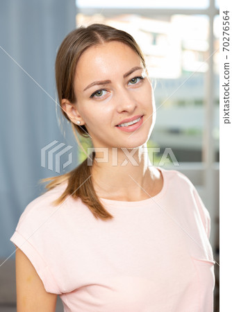 Female posing in living room interior 70276564