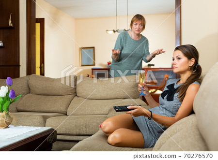 Mature mom scolds adult daughter in room at home Mature mom scolds adult daughter in room at home 70276570